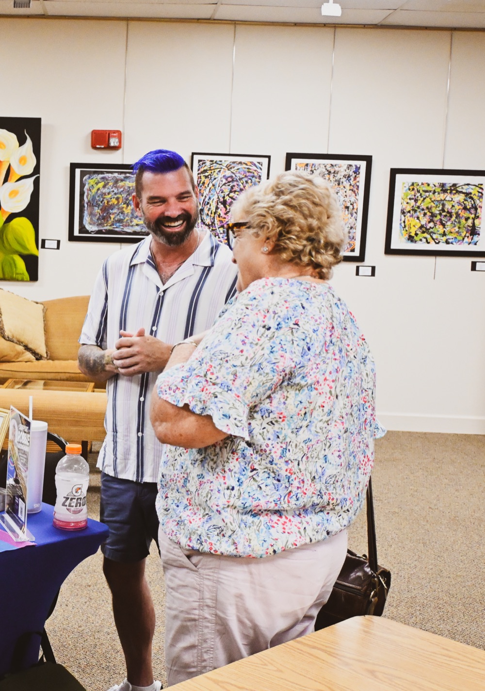 Robbie Hardingham talking with a resident at a community event in Vero Beach